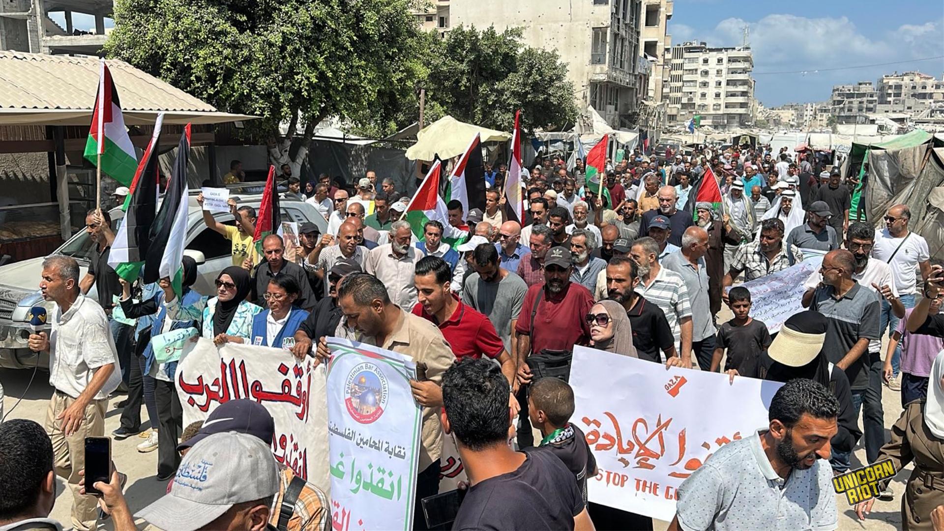 Hundreds of Palestinians in Gaza City march against Israeli's war on Gaza and forced displacement. Many are seen holding banners and Palestinians flags - August 21, 2025
