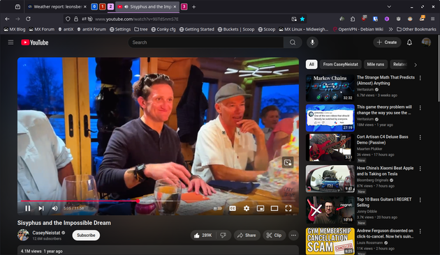 The image shows a YouTube video page with a video titled "Sisyphus and the Impossible Dream" by Casey Neistat, featuring 1.4M views and uploaded a year ago. The video thumbnail depicts two men (dad son) sitting at a table, one in a dark shirt and the other in a white shirt and cap, with glasses of drinks in front of them. The background suggests an indoor setting with a window showing a blue sky. The video player interface includes playback controls, a subscribe button, and a timestamp showing 3.56 minutes out of 11:53. The right side of the screen displays a sidebar with recommended videos, including titles like "Markov Chains," "The Strange Math That Predicts (Almost) Anything," and "Cort Arfisan C4 Deluxe (Passive)." There is also a banner at the bottom promoting a gym membership cancellation scam. The browser's address bar shows the URL for the video, and the tabs at the top include various bookmarks and settings.

Provided by @altbot, generated privately and locally using Ovis2-8B

🌱 Energy used: 0.227 Wh