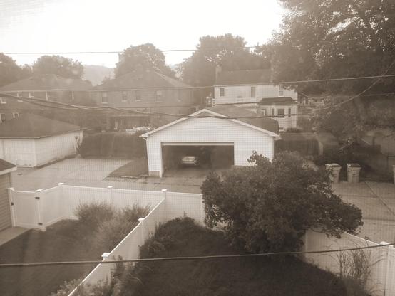 A garage with the door open.