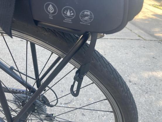 A strap hanging down near the wheel
