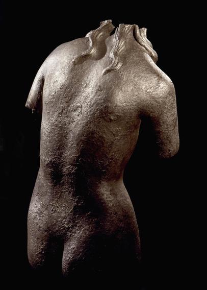 Bronze torso of Aphrodite. Head, arms, and legs are missing but she still has a gorgeous back and beautiful buttocks.