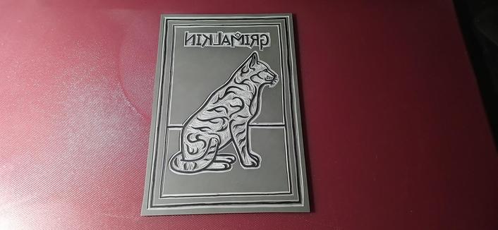 Image 1 of 3:
My Grimalkin cat carved into lino. I have the design of a cat drawn onto lino with black permanent marker and the empty space around the linework has been carved away to show a raised design.
