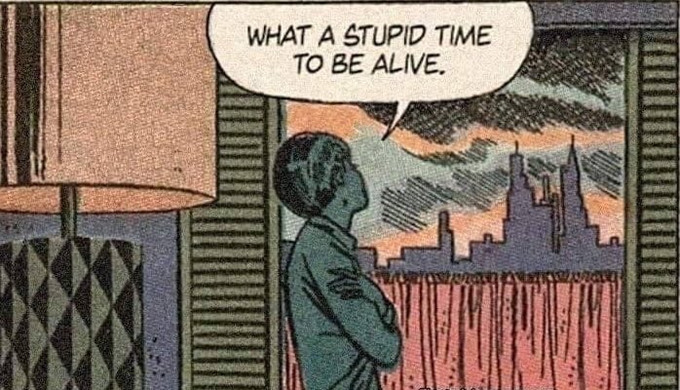 Cartoon of a lady looking out through a window at a skyline at dusk, saying "What a stupid time to be alive." There is a mid-century table lamp in the foreground. 
