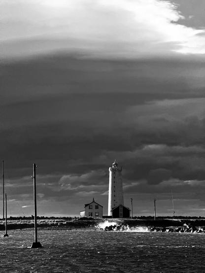 Gróttuviti in black and white with an angry sea and ominous clouds 