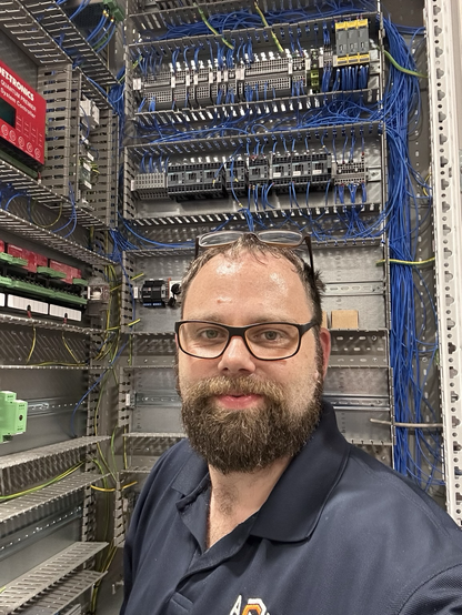 Various terminals and relays within industrial control panel rack