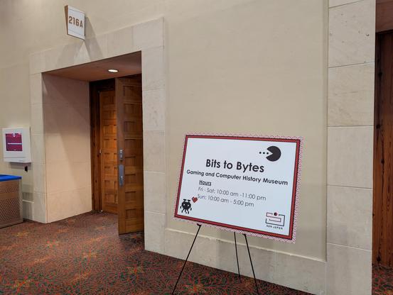 A sign with the hours of operations for the museum. Friday and Saturday 10am to 11pm, Sunday 10am to 5pm
