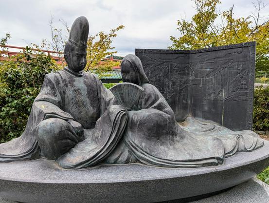 Tale of Genji monument by the banks of the Uji-gawa (depicting a couple in Heian period dress).