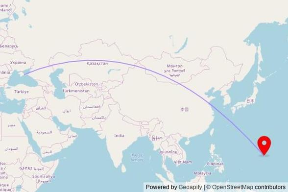 A map showing the great circle route from Feodosia in Ukraine to a map pin at Saint Anthony Catholic Church, Gumayuos Street, Tamuning, GU 96911, United States of America