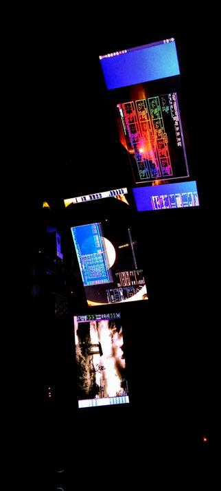 The photograph shot in pitch black darkness features a collection of computer monitors arranged in a vertical composition against a dark background. The screens display various colorful interfaces and images, including a blue screen with text, a screen with a colorful, grid-like pattern, a screen with a blue background and a circular graphic, and a screen showing a scene with a bright explosion. The monitors are positioned at different angles, creating a dynamic and layered visual effect. The overall scene suggests a high-tech environment, possibly a control room or a digital workspace.

Provided by @altbot, generated privately and locally using Ovis2-8B

🌱 Energy used: 0.142 Wh