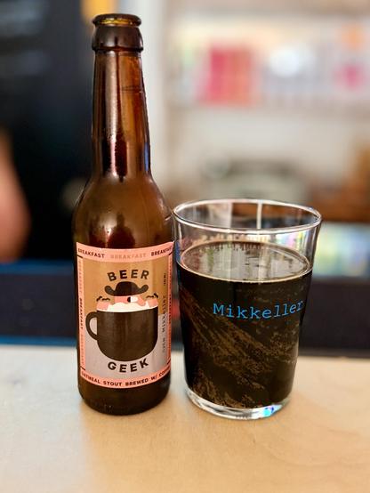 A bottle and glass full of Beer Geek Breakfast