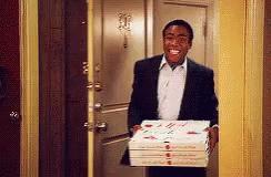 Community meme of Troy bringing pizza to a chaotic burning room