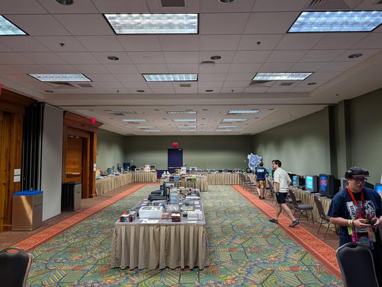 A large room full of exhibits and interactive gaming stations