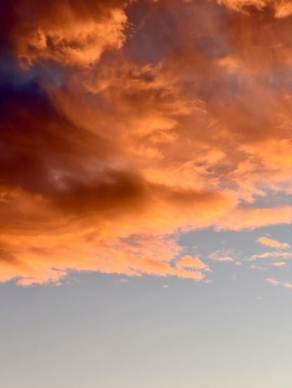 Close up on some dramatically sunset-lit clouds