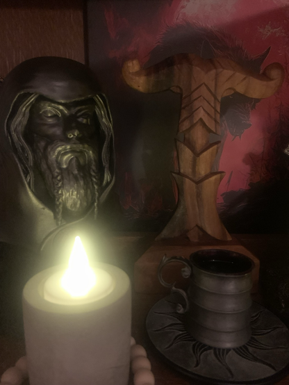 Pagan altar with Wodan statue and wine offering 
