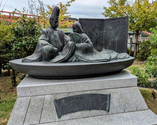 Monument to The Tale of Genji featuring a Heian noble couple.