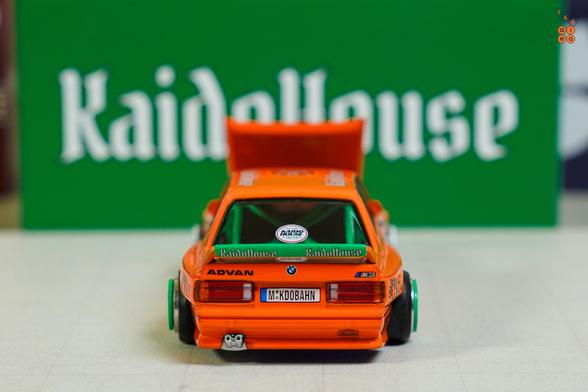 A rear side of BMW M3 E30, KaidoHaus V1 by Mini GT in 1:64 scale on AREA 164