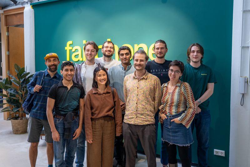 A group of 10 young people pose with beaming smiles in the lobby of Fairphone 

Found this on: 

https://www.reddit.com/r/framework/comments/1n85jxj/framework_team_at_fairphone_hq/

Text from LinkedIn post: 

A big Fairphone welcome to Framework!

We're excited to have our friends from Framework over at our HQ in Amsterdam. We both share a vision: proving that technology can be built to last with modular, repairable and sustainable design at its core. 

It’s always great to see how different companies, each in their own way, are re-shaping the industry toward a more sustainable future. These exchanges help us learn, reflect, and reinforce the belief that positive change in electronics is not only possible, it’s happening right now. 

Thank you Framework for visiting. We truly appreciated the meaningful conversations and the shared commitment to our mission.