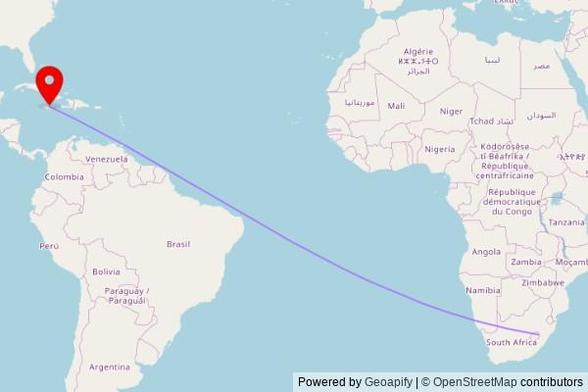 A map showing the great circle route from Ha Koeneho Luma in Lesotho to a map pin at Our Lady of Fatima, Main Street, Ocho Rios, Jamaica