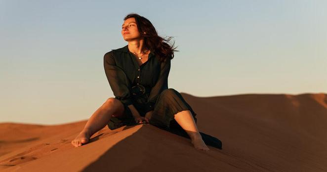 a women the desert sand dunes