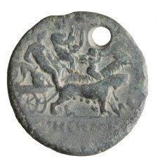 Silver disk showing Dionysos sitting, holding his thyrsus, with Apollo Citharoedus (Apollo the kithara player) beside him in a biga chariot drawn by a female panther and a goat on which sits Silenos playing the double flute. A biga is a chariot drawn by two animals. The female panther has large, visible teats, illustrating Dionysos' fertility powers.