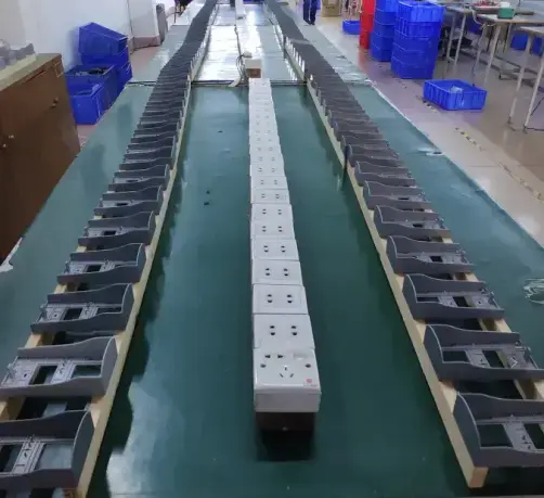 Workers assembling security devices at IUFUTURE's production line.