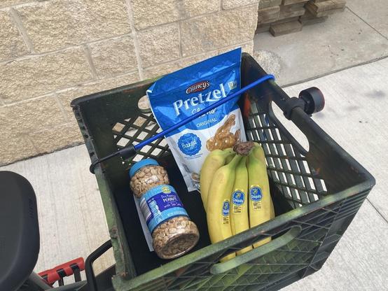 Bananas in a milk crate on the back of a bike. 