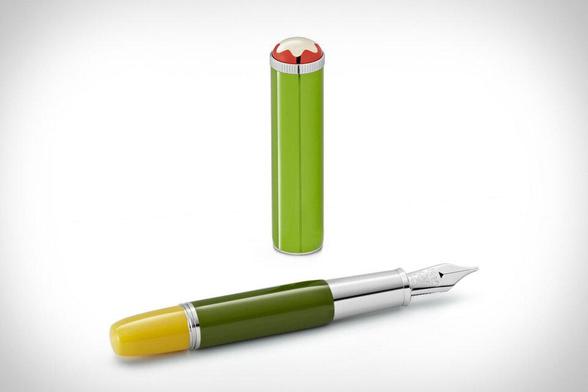 A fancy fountain pen in shades of green, yellow and red.