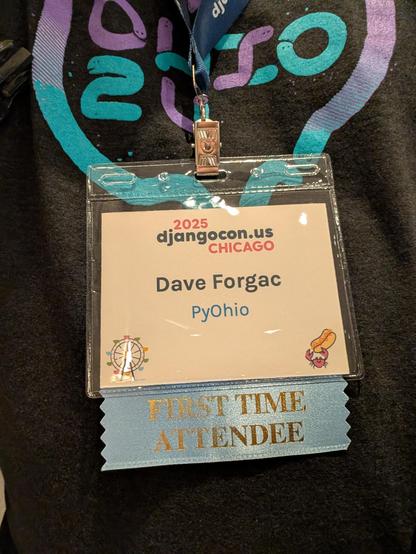 DjangoCon US 2025 conference badge with first time attendee ribbon