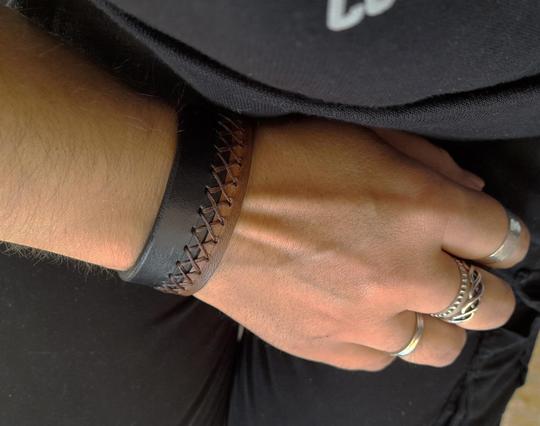 a leather cuff worn on wrist