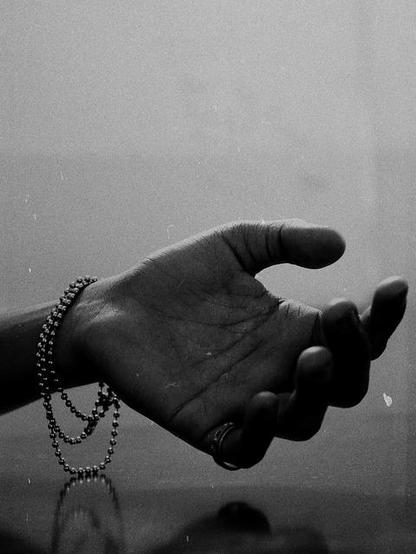 wrist wearing a chain bracelet