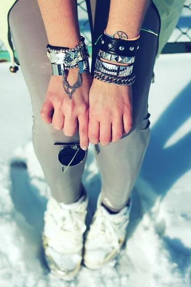 woman weraing stacked bracelets on both wrists