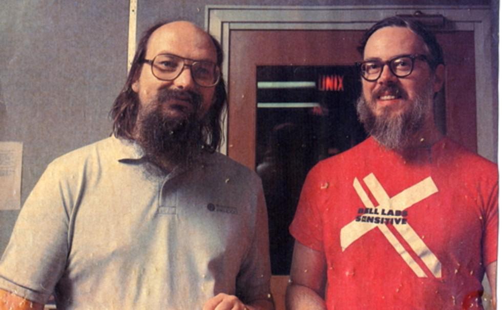 Informal portrait of Thompson & Ritchie from https://computerhistory.org/blog/discovering-dennis-ritchies-lost-dissertation/ where it says: "original source unknown". Informal portrait of Thompson & Ritchie from https://computerhistory.org/blog/discovering-dennis-ritchies-lost-dissertation/ where it says: "original source unknown".