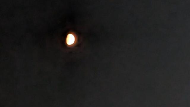 it's the moon! blurry in a dark sky!