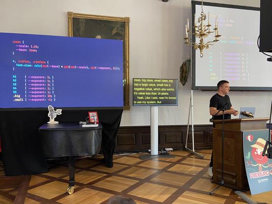 Manuel on stage showing his fluid type solution using pow()