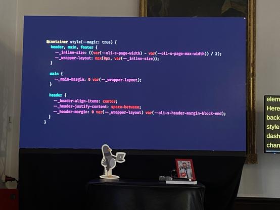 A slide showing the base layout for a site, defined with a container style query with the custom property --magic