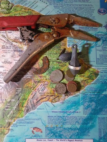 Metal detecting finds include coins, lead weights,pair of vice grips and a silver ring