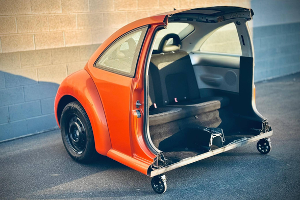 Beetle cut in half with only the back seats available. Meant to be a couch.