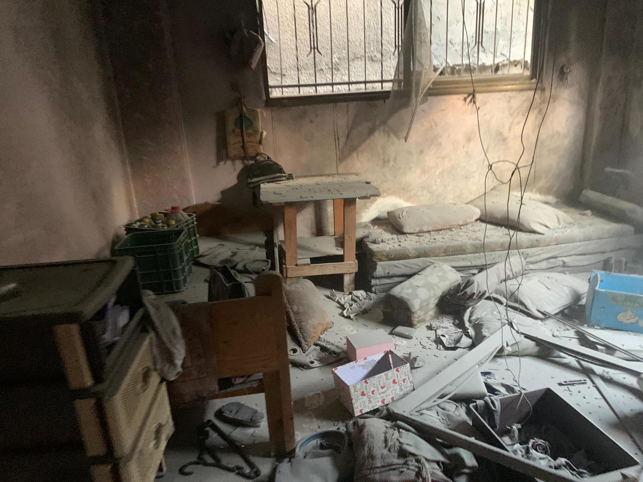 Mohammed Shobair, 22 years old, from Gaza, standing in the ruins of our old flat.