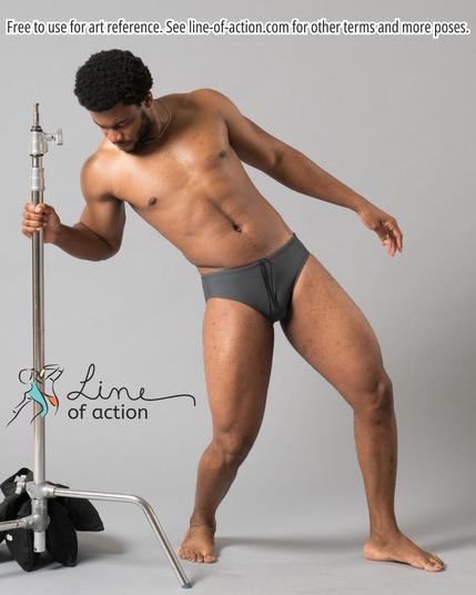 Model Javani poses in grey briefs. The Line of Action logo is at the bottom. Text reads: Free to use for art reference. See line-of-action.com for other terms and more poses.