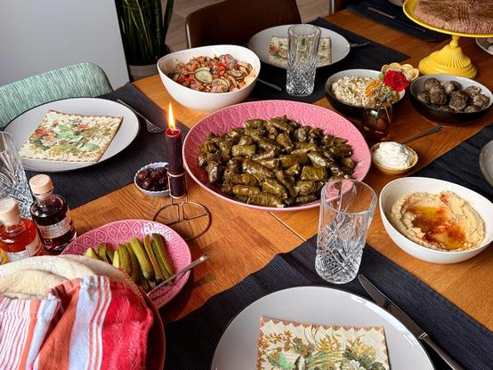 A table packed with plates and food
