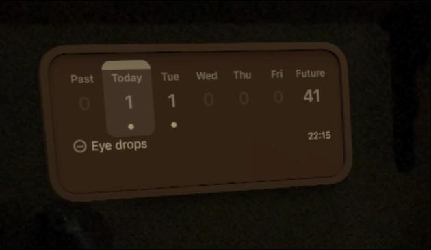 Screenshot from visionOS 26 of an OmniFocus Forecast widget inset into the wall under a shelf.