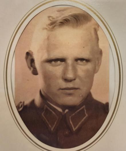 My father when he was young. He has light hair and intensive eyes. The photo is b&w and old and taken when he was in the army. 