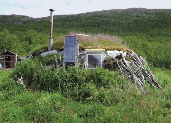 A makeshift hut with solar panels.