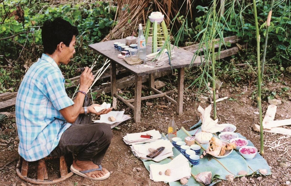 A shaman is preparing a decoction.