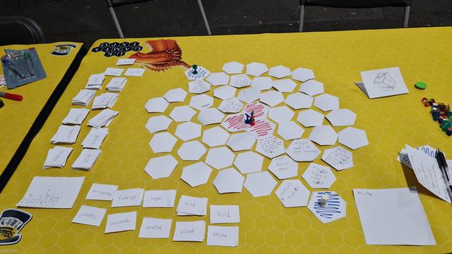 Assorted prototype board games, paper cut out pieces, counters and cards WIP from the Tabletop Scotland Game Jam
