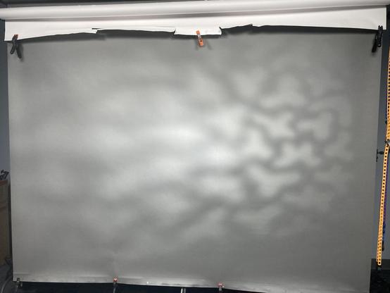 A paper roll with light hitting it.