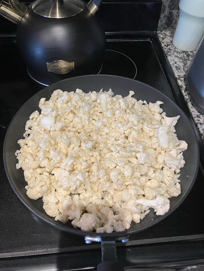 Cauliflower batch on frying pan.