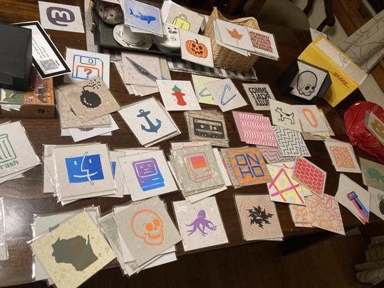 A table covered in relief prints.