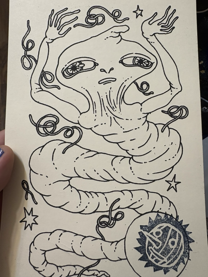An artist depiction of a ghostly friend. They look something like intestine with big, wide eyes and wiggly fingers. Includes official notary stamp of a pumpkin face.