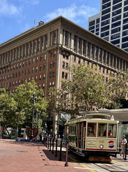 Full information here https://www.streetcar.org/cablecars/55-no-55-cable-car/ 

No. 55
San Francisco Municipal Railway, 1956
Built 1906, J. Hammond & Co.; Rebuilt 2021-25 by Muni Shops
This cable car wears a livery that’s both familiar to San Franciscans and unique at the same time – at least for a double-ended California Street cable car.